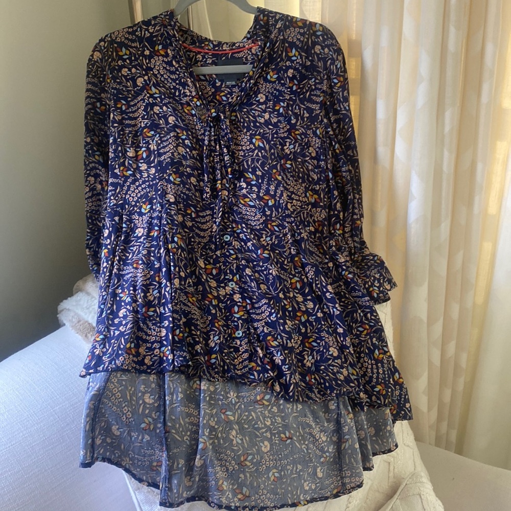 High/low button down floral blouse.